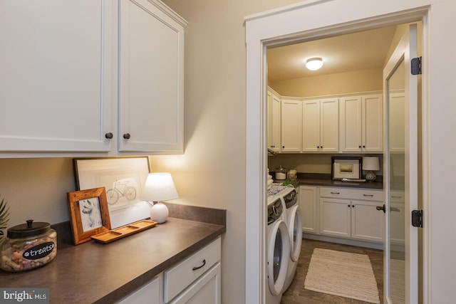 clothes washing area with cabinets, carpet, and independent washer and dryer