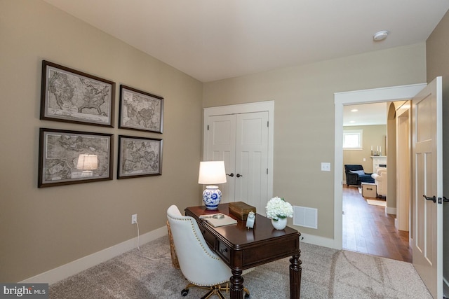 office with light hardwood / wood-style floors