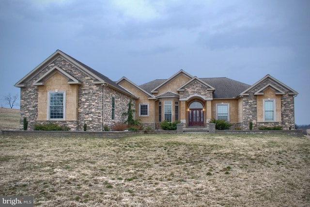 craftsman house featuring a front yard