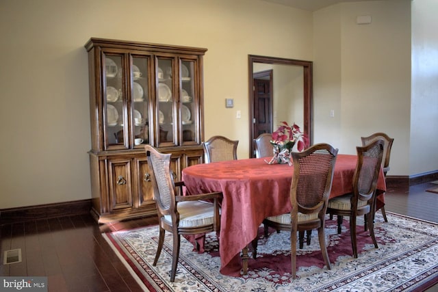 dining area featuring dark hardwood / wood-style flooring