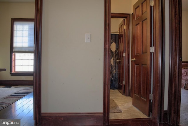 hallway featuring light tile floors