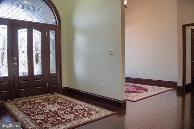 entryway with dark hardwood / wood-style floors