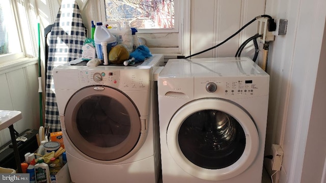 washroom with independent washer and dryer