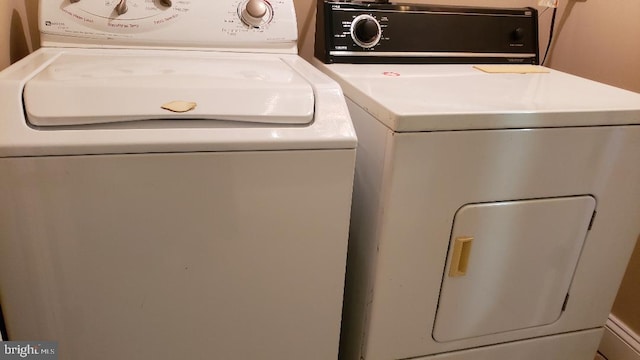 laundry area featuring washing machine and dryer