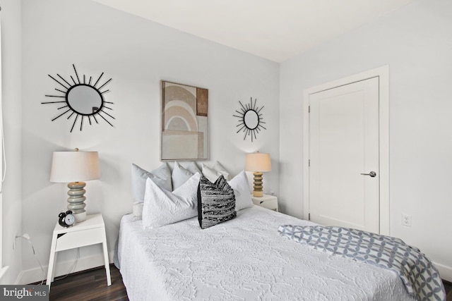 bedroom featuring dark wood-type flooring