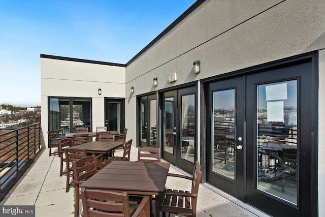 balcony with french doors and a patio