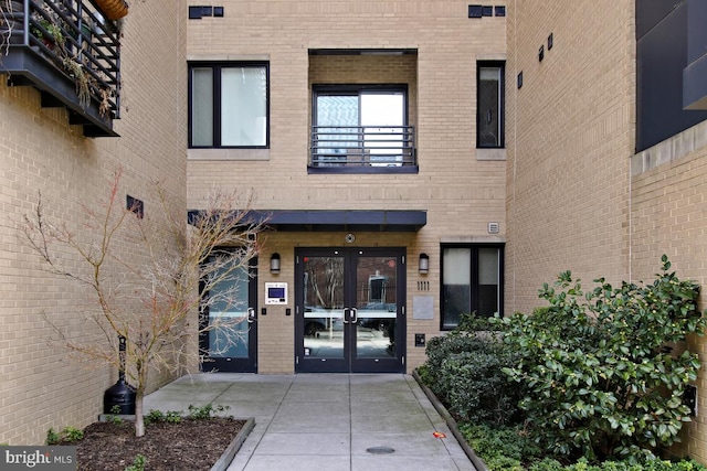 property entrance featuring french doors