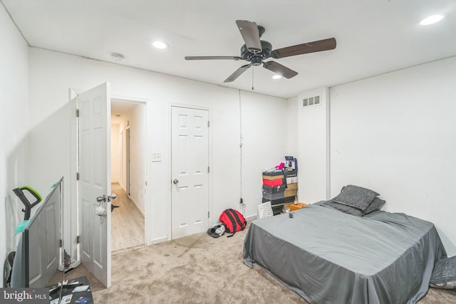 carpeted bedroom with ceiling fan