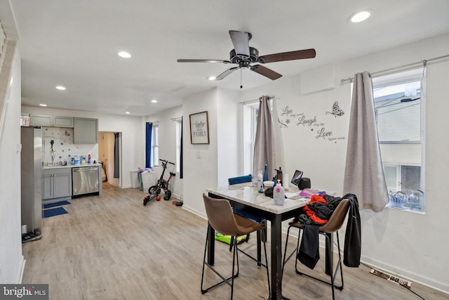 dining area featuring light hardwood / wood-style flooring and ceiling fan