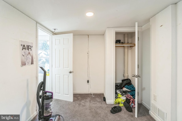 exercise area featuring carpet flooring