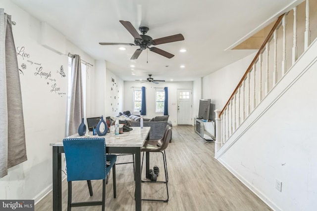 dining room featuring light wood-type flooring and ceiling fan