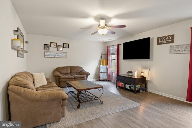 living room with hardwood / wood-style floors and ceiling fan