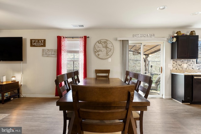 dining area featuring light hardwood / wood-style flooring and plenty of natural light