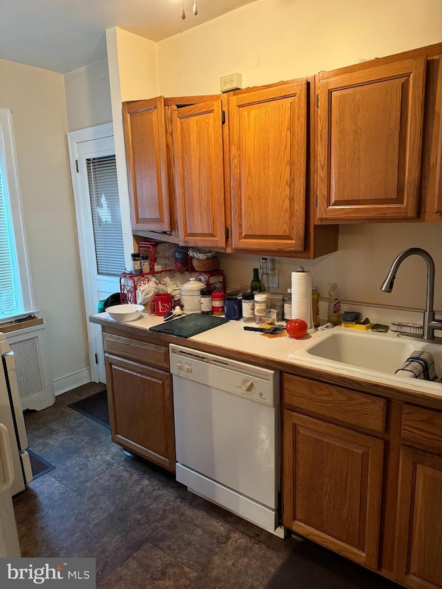 kitchen featuring dishwasher and sink