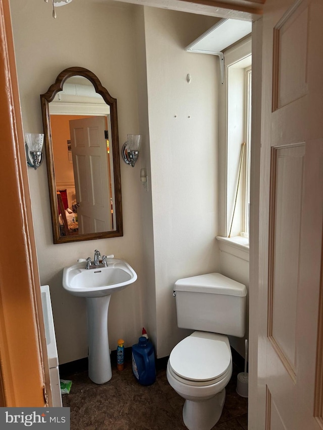 bathroom featuring sink and toilet