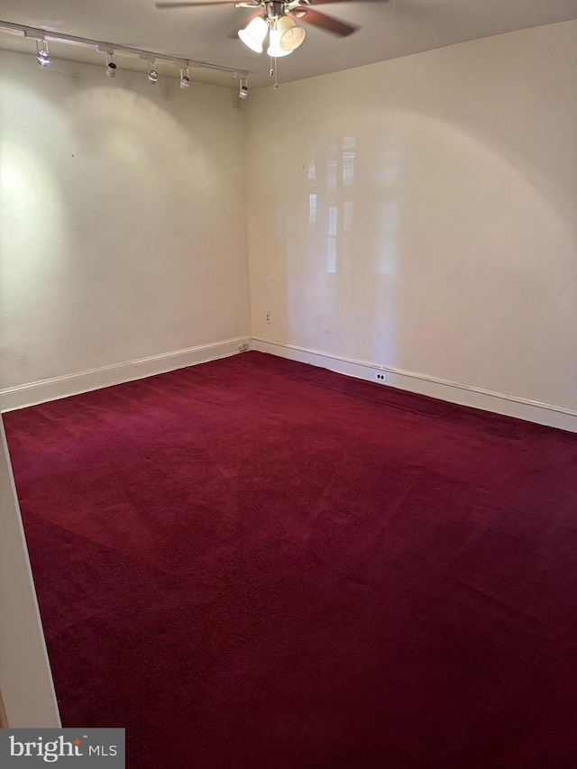 empty room with carpet flooring and ceiling fan