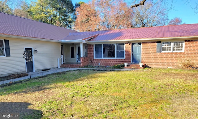 ranch-style house with a front lawn