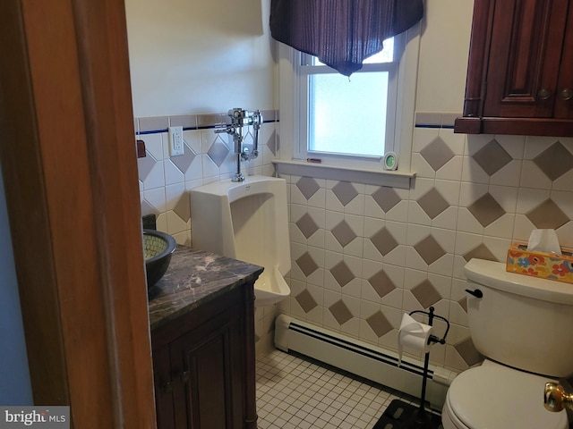 bathroom with tile walls, backsplash, toilet, tile flooring, and baseboard heating