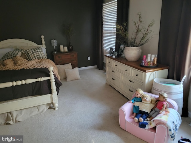 bedroom featuring light carpet