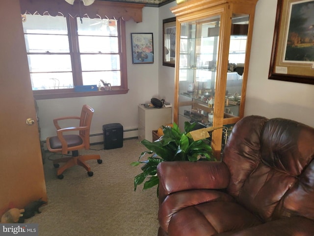 home office featuring a baseboard heating unit and carpet floors