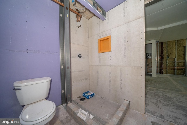 bathroom with a shower and toilet