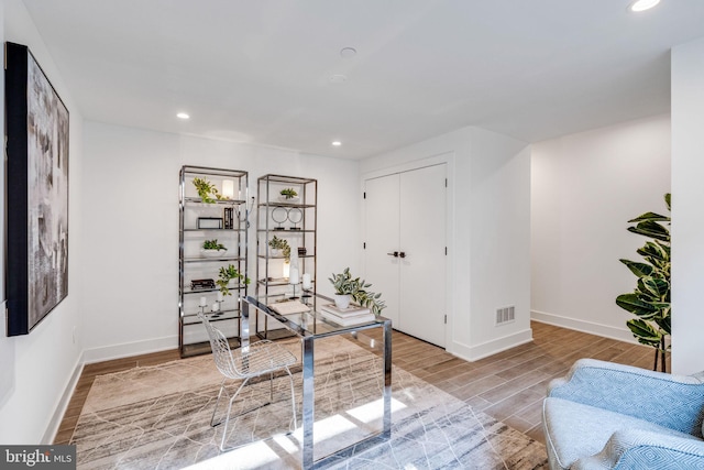 office space with light wood-type flooring