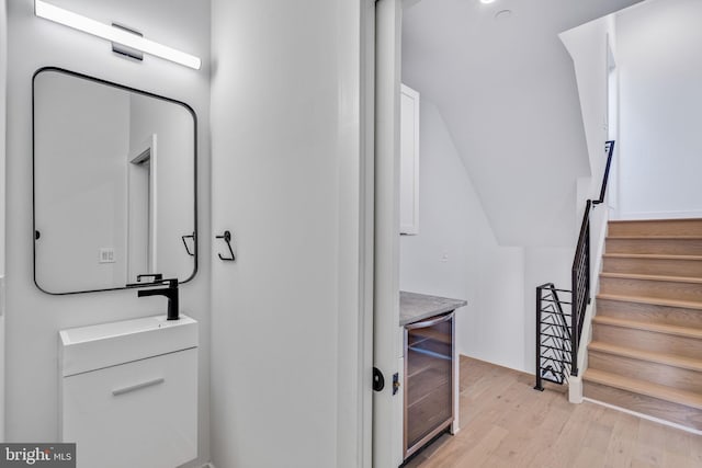 bathroom with vanity and wood-type flooring