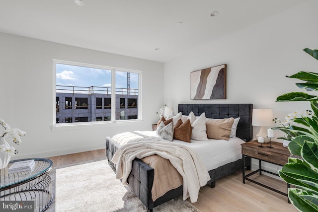 bedroom with light hardwood / wood-style flooring