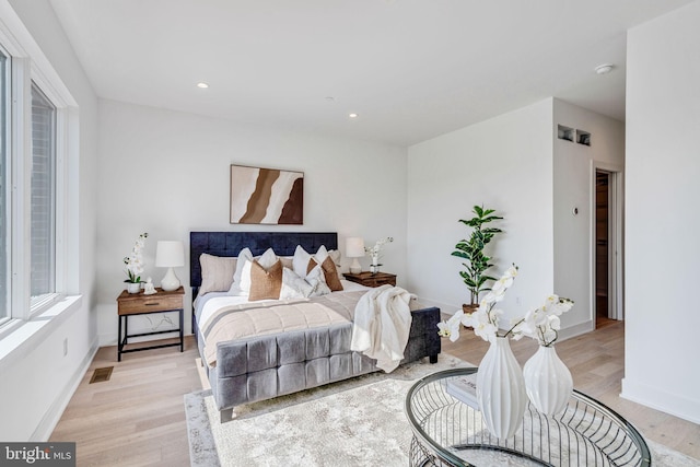 bedroom with light wood-type flooring