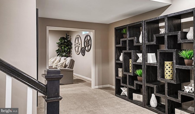 interior space featuring stairs and baseboards