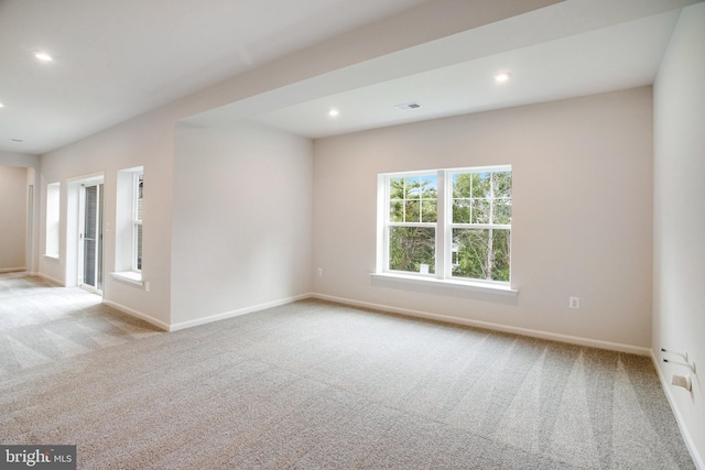 carpeted empty room with recessed lighting and baseboards