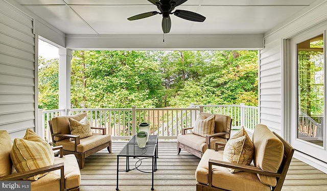 sunroom with a ceiling fan