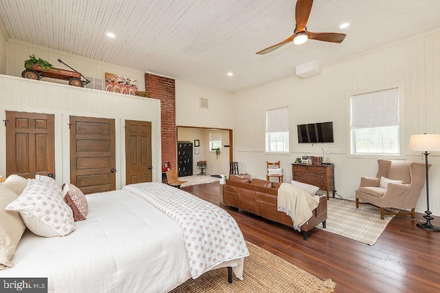 bedroom with ceiling fan, crown molding, and dark hardwood / wood-style floors