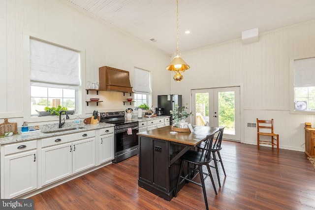 kitchen featuring french doors, white cabinetry, sink, and stainless steel appliances