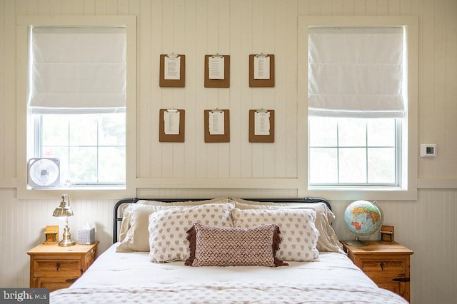 bedroom with multiple windows