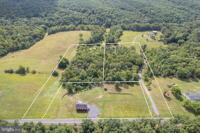 birds eye view of property featuring a rural view