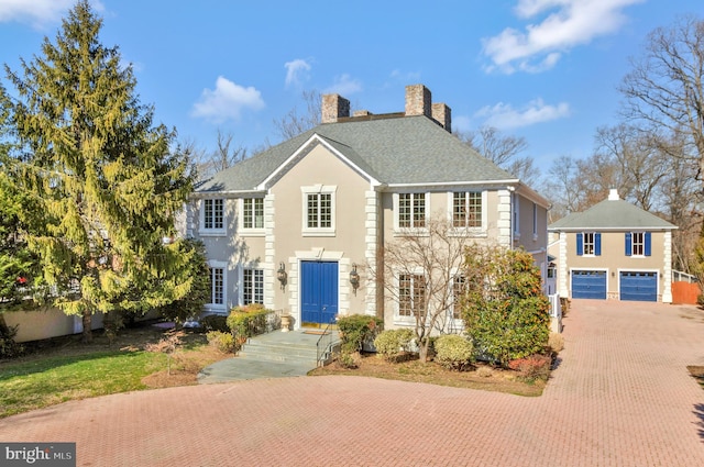 colonial home with a garage