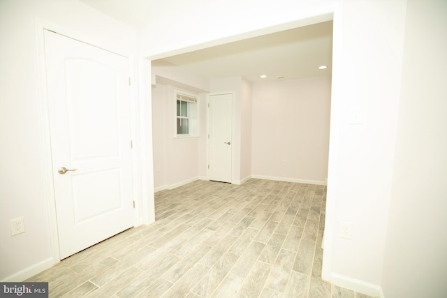 unfurnished room with light wood-type flooring