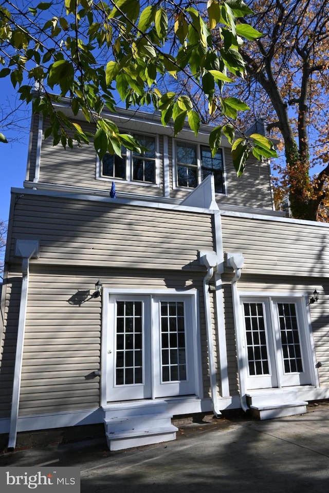 rear view of property with french doors