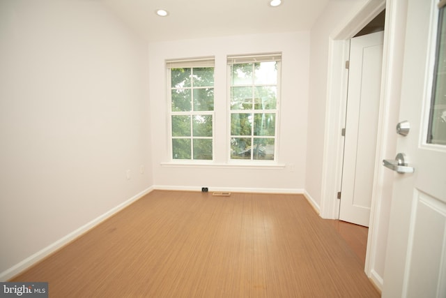 spare room featuring light hardwood / wood-style flooring