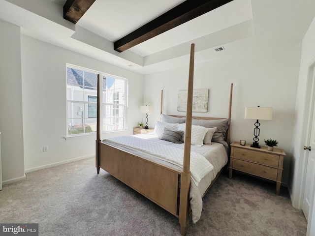 carpeted bedroom featuring beam ceiling