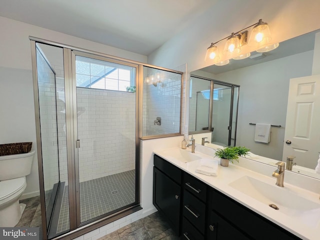 bathroom featuring walk in shower, vanity, and toilet