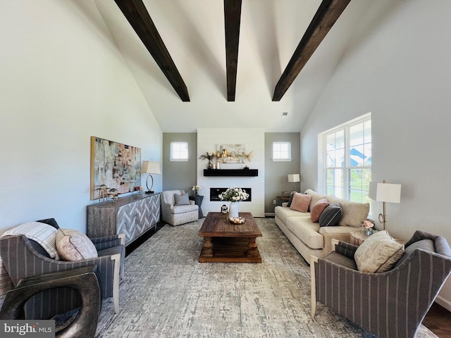 living room featuring beamed ceiling, hardwood / wood-style floors, and high vaulted ceiling