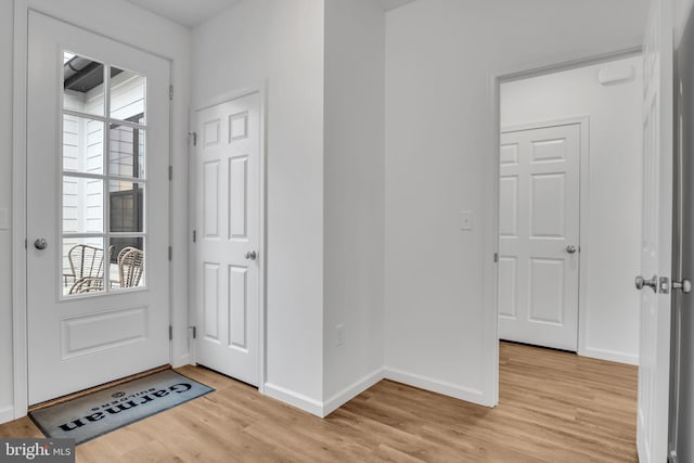 foyer with light hardwood / wood-style floors