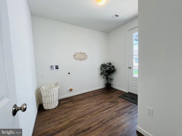 washroom featuring electric dryer hookup, dark hardwood / wood-style flooring, and hookup for a washing machine