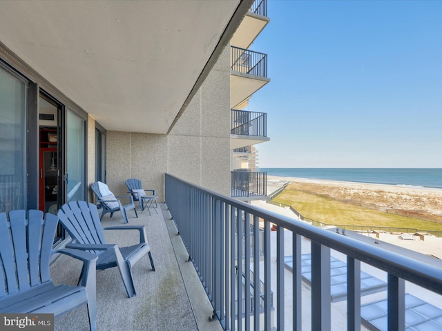 balcony featuring a water view