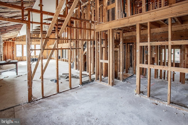 miscellaneous room with high vaulted ceiling