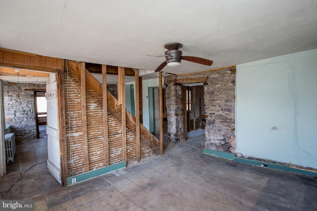 interior space featuring ceiling fan and radiator