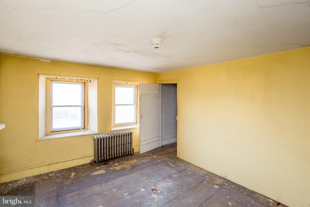 spare room featuring radiator