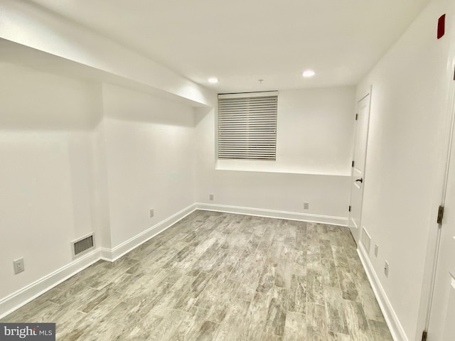 spare room with light hardwood / wood-style flooring